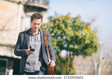 Similar – Image, Stock Photo A man walks in the snowy forest on a path towards a clearing / winter / snow cover