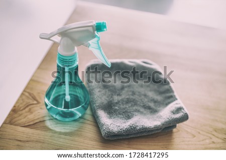 Surface cleaning home kitchen All purpose cleaner disinfectant spray bottle with towel to clean high touch surfaces from COVID-19 virus contagion.