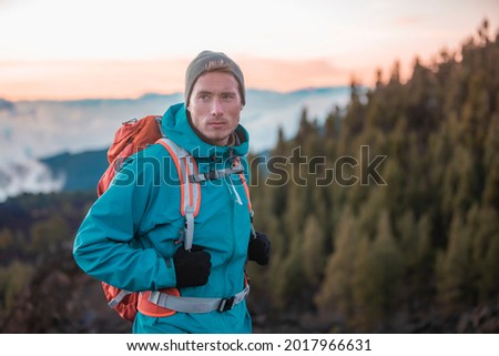 Image, Stock Photo Man hiker with backpack enjoying Lago Antorno Lake,Tre Cime di Lavaredo mountain in background, Dolomites, Italy