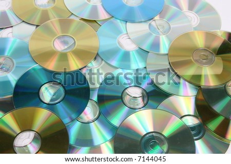 A pile of blue, gold and silver compact discs
