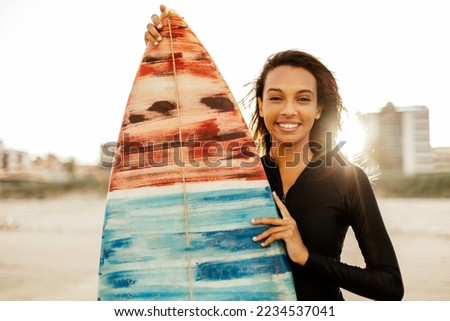 Similar – Image, Stock Photo Female surfer standing at the beach with surfboard