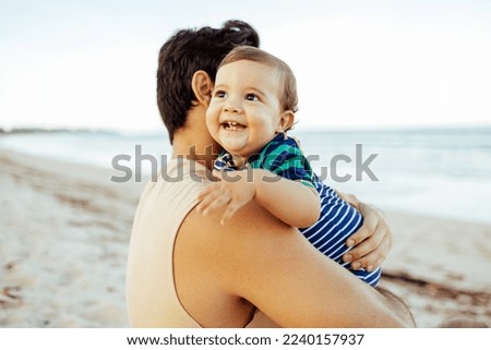 Similar – Foto Bild Zeit in Familienqualität. Vater und Tochter sitzen in einem selbstgebauten rosa Zelt mit Blumen, lesen ein großes Buch, sehen sich an, lächeln und lachen. Gemütliches stilvolles Zimmer. Konzept für Familienbande