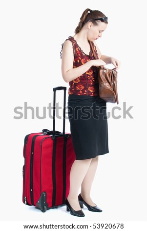 A female passenger searching for something in her bag