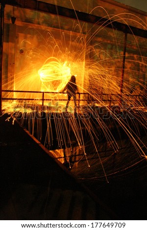 Molten Shower - Long exposure of steel wool being showered on a girl