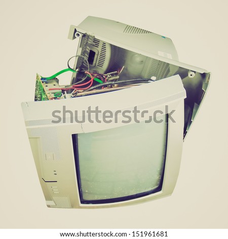 Vintage looking Old broken TV set isolated over white background