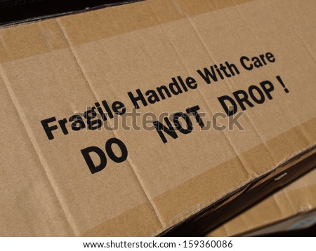 Fragile Handle with Care Do not drop label on a corrugated cardboard box