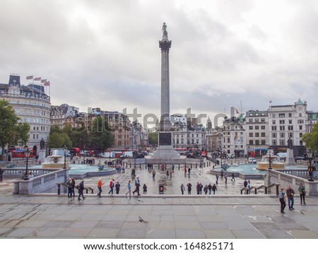 LONDON, ENGLAND, UK - OCTOBER 23: Tourist visiting the world famous Trafalgar Square on October 23, 2013 in London, England, UK