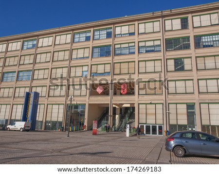 TURIN, ITALY - JANUARY 24, 2014: The Fiat Lingotto car factory designed by Trucco in 1916 was the largest car factory at the time and still houses the Fiat directional centre and an exhibition complex