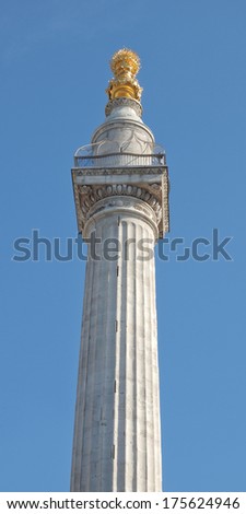 The Monument to commemorate the Great Fire of London in 1666 - over blue sky background
