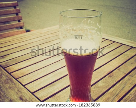 Vintage retro looking A glass of German weiss beer
