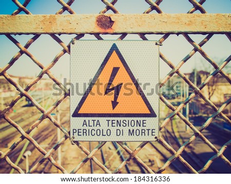 Vintage retro looking Sign of risk of electric shock by electrocution - in Italian