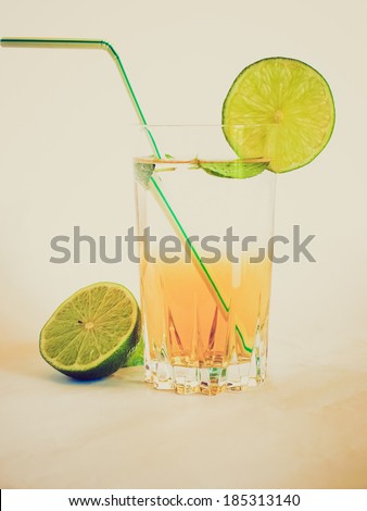 Vintage retro looking Cocktail mixed alcoholic drink with lime and peppermint