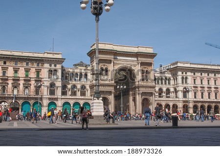 MILAN, ITALY - APRIL 10, 2014: Tourists visiting the Piazza Duomo square in Milan Italy