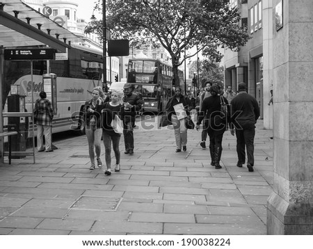LONDON, ENGLAND, UK - OCTOBER 23: Tourists walking on The Strand busy high street on October 23, 2013 in London, England, UK