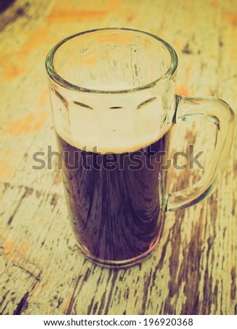 Vintage retro looking A glass of German dark beer