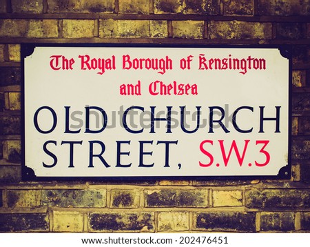 Vintage retro looking Old street sign in Chelsea, London, UK