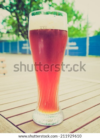 Vintage retro looking A glass of German weiss beer