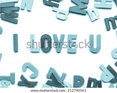 I love you message written with plastic toy characters - cool cyanotype