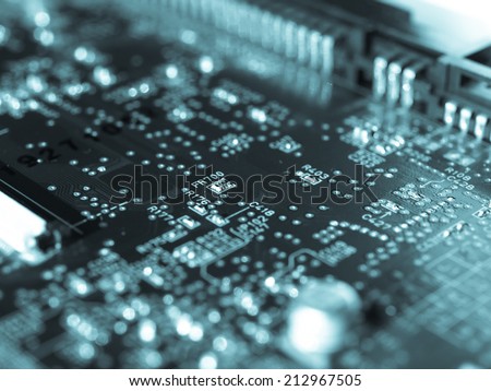 Detail of an electronic printed circuit board - selective focus - cool cyanotype - cool cyanotype