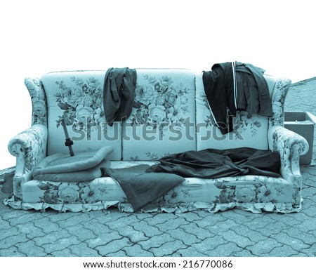 Old sofa with clothes used by poor homeless hobo - cool cyanotype