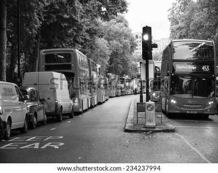 LONDON, ENGLAND, UK - OCTOBER 23: Row of double decker red buses waiting to depart from on October 23, 2013 in London, England, UK