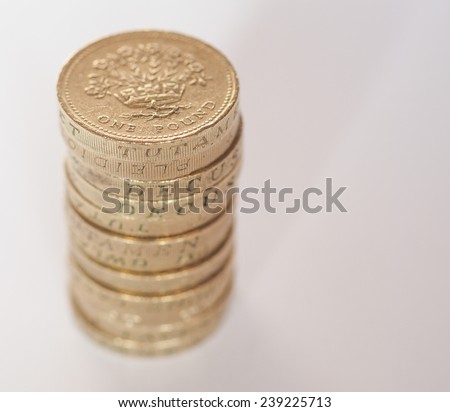 Pile of One Pound coins from UK - with copy space