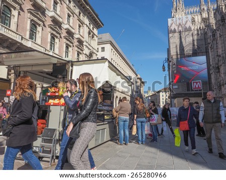 MILAN, ITALY - MARCH 28, 2015: Tourists in the Milan city centre in Italy
