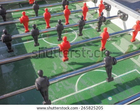 Table football aka table soccer, foosball from the German Tischfussball, baby-foot or kicker table-top game and sport