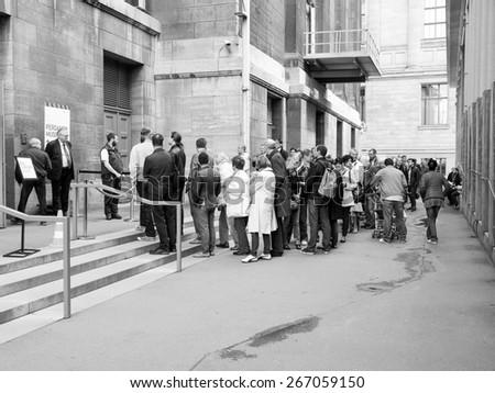 BERLIN, GERMANY - MAY 10, 2014: People queuing in front of the Pergamon Museum of antiquities on the Museumsinsel in black and white