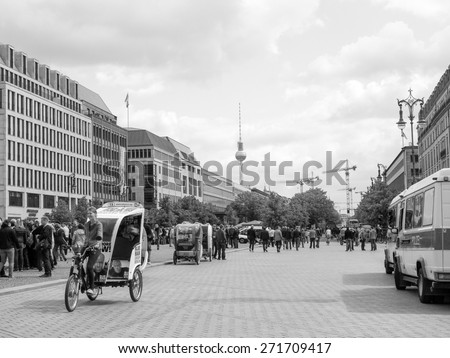 BERLIN, GERMANY - MAY 10, 2014: Tourists in Unter den Linden boulevard in black and white