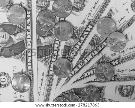 One cent coins and One Dollar banknotes  currency of the United States useful as a background in black and white