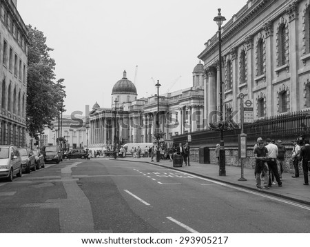 LONDON, UK - JUNE 12, 2015: Tourists in busy central London street in black and white