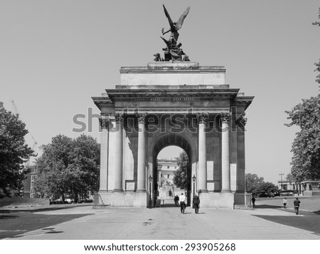 LONDON, UK - JUNE 11, 2015: Tourists visiting the Wellington arch in black and white
