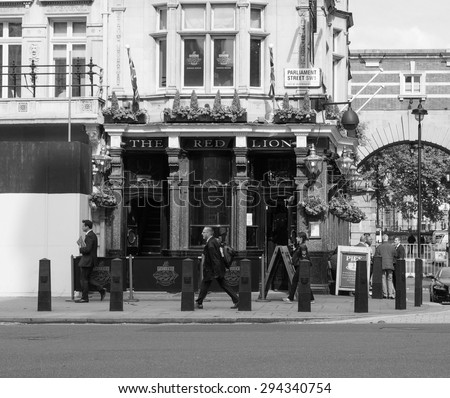 LONDON, UK - JUNE 09, 2015: The Red Lion pub situated in London political heart near the Houses of Parliament has been the favoured pub of the political elite for centuries in black and white