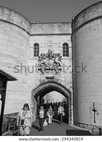LONDON, UK - JUNE 11, 2015: Tourists visiting the Tower of London in black and white
