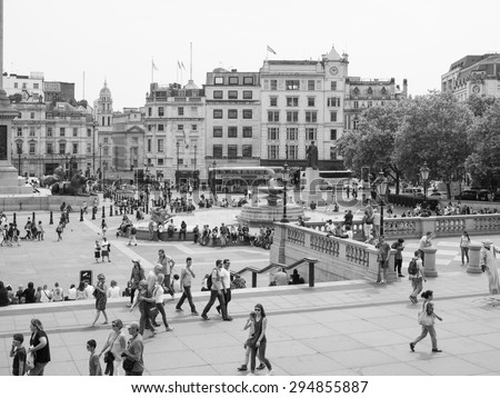 LONDON, UK - JUNE 12, 2015: Tourists visiting Trafalgar Square in black and white