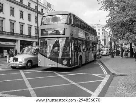 LONDON, UK - JUNE 09, 2015: Red double decker buses are a traditional landmark of London in black and white