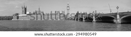 LONDON, UK - JUNE 10, 2015: High resolution panoramic view of the Houses of Parliament Big Ben and Westminster Bridge seen from river Thames in black and white