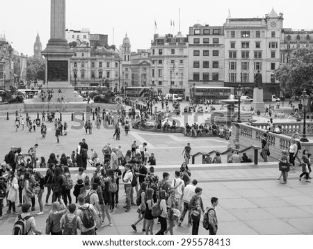 LONDON, UK - JUNE 12, 2015: Tourists visiting Trafalgar Square in black and white
