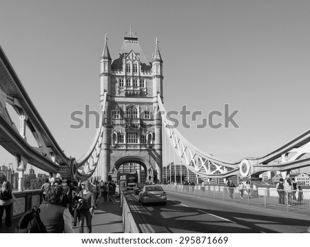 LONDON, UK - JUNE 11, 2015: Tourists visiting Tower Bridge on River Thames in black and white