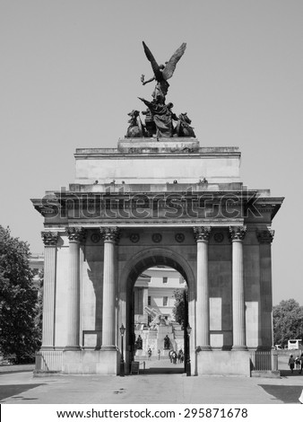 LONDON, UK - JUNE 11, 2015: Tourists visiting the Wellington arch in black and white