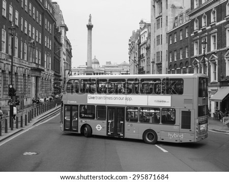 LONDON, UK - JUNE 12, 2015: Red double decker buses are a traditional landmark of London in black and white