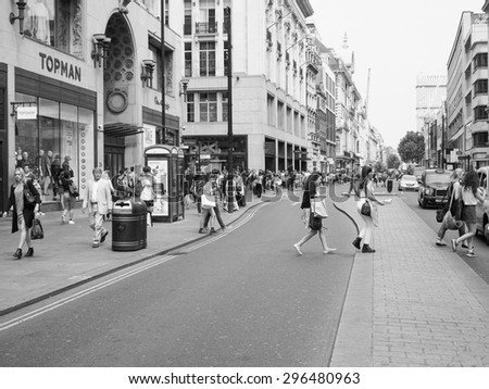 LONDON, UK - JUNE 12, 2015: Tourists in busy central London street in black and white