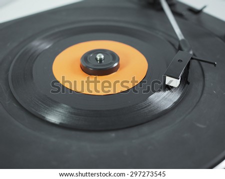 Vinyl record on a turntable record player, single 45rpm disc