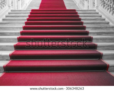 Red carpet on a stairway used to mark the route taken by heads of state, vips and celebrities on ceremonial and formal occasions or events
