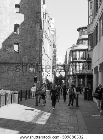 LONDON, UK - JUNE 11, 2015: Tourists in busy central London street in black and white