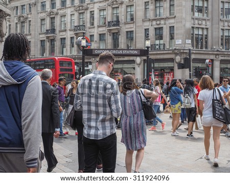 LONDON, UK - JUNE 12, 2015: Travellers at Oxford Circus underground station