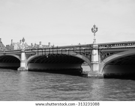 Westminster Bridge over River Thames in London, UK in black and white