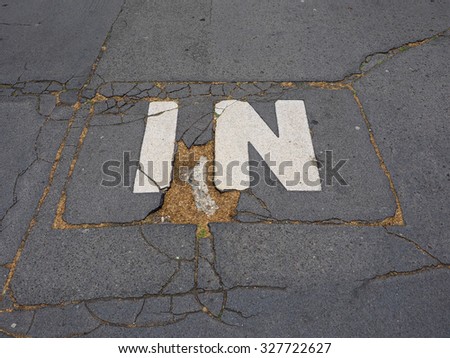 In sign on tarmac in the street