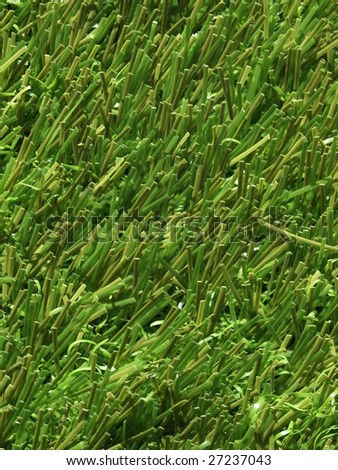 Detail of green grass artificial lawn meadow, useful as a background